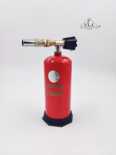 A red portable gas torch gun with a black base and gold-colored nozzle, branded 'Wonder Gold Flame'.