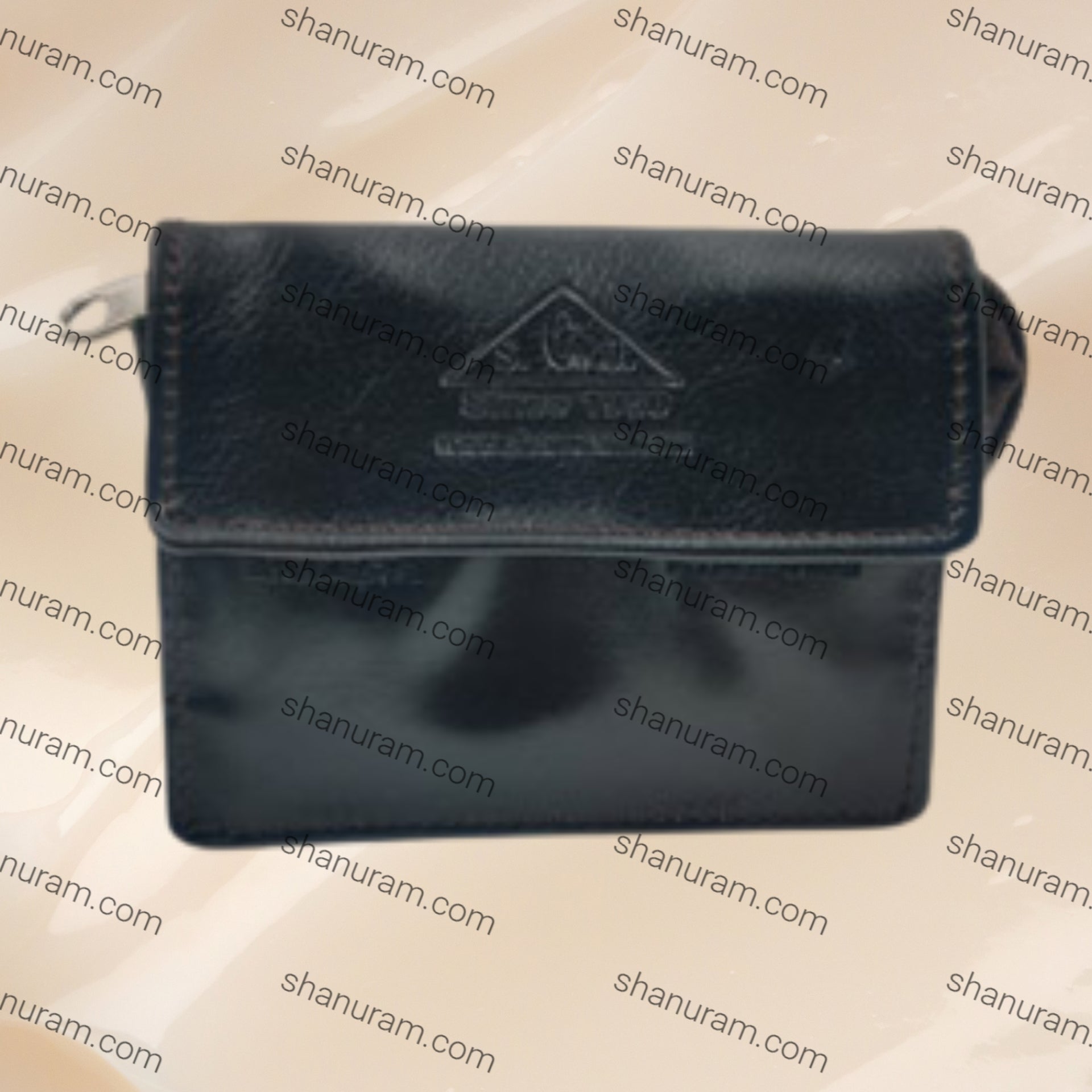Black leather wallet with a brand logo on a beige background