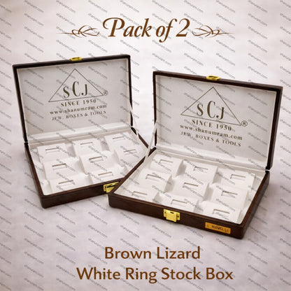 Two open jewelry boxes with 'SCJ' branding on a patterned background