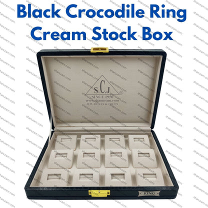 Black crocodile ring cream stock box with compartments on a white background