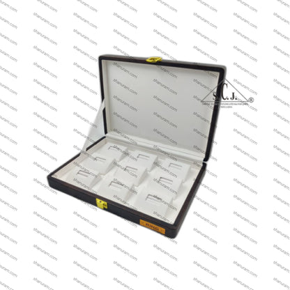 Open jewelry box with compartments on a branded background