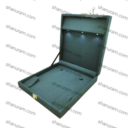 Green jewelry box with a lid open on a white background with 'shanuram.com' watermark.