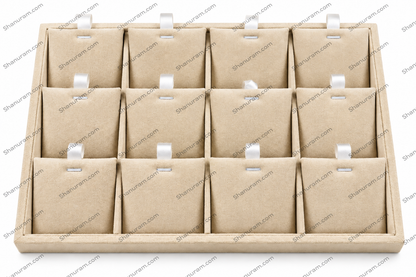 A 12-compartment jewelry display tray made of light brown kraft paper with small white plastic hangers in each slot, shown on a white background with repeating watermark text.